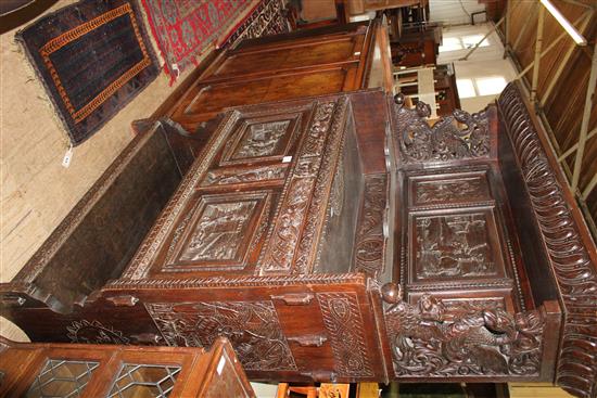 Late Victorian carved oak Flemish style court cupboard